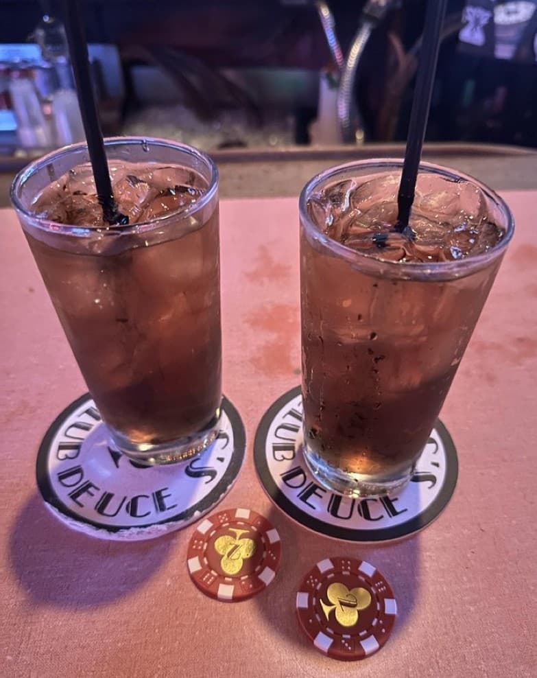 Cocktails and poker chips at Mac's Club Deuce Miami Beach