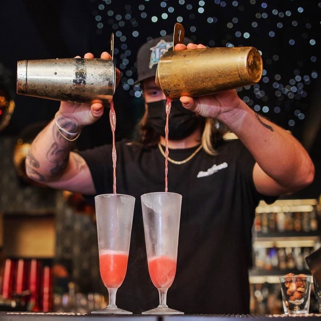 Bartender pouring drinks at Mama Tried in Miami