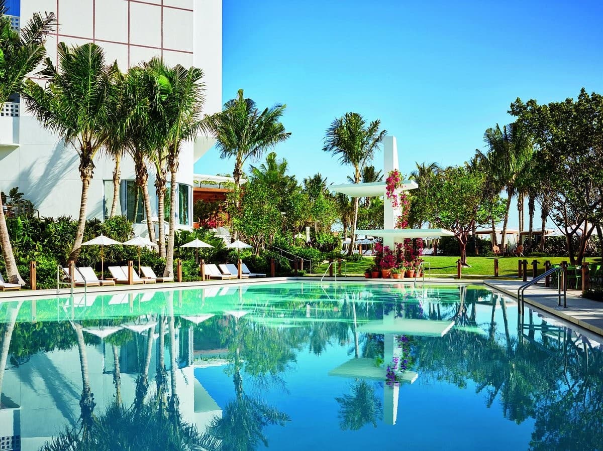 Market at The Miami Beach EDITION pool area and palm trees