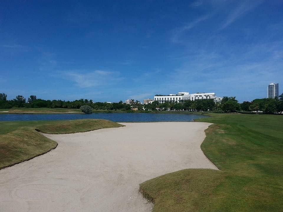 Miami Beach Golf Club exterior view with lake