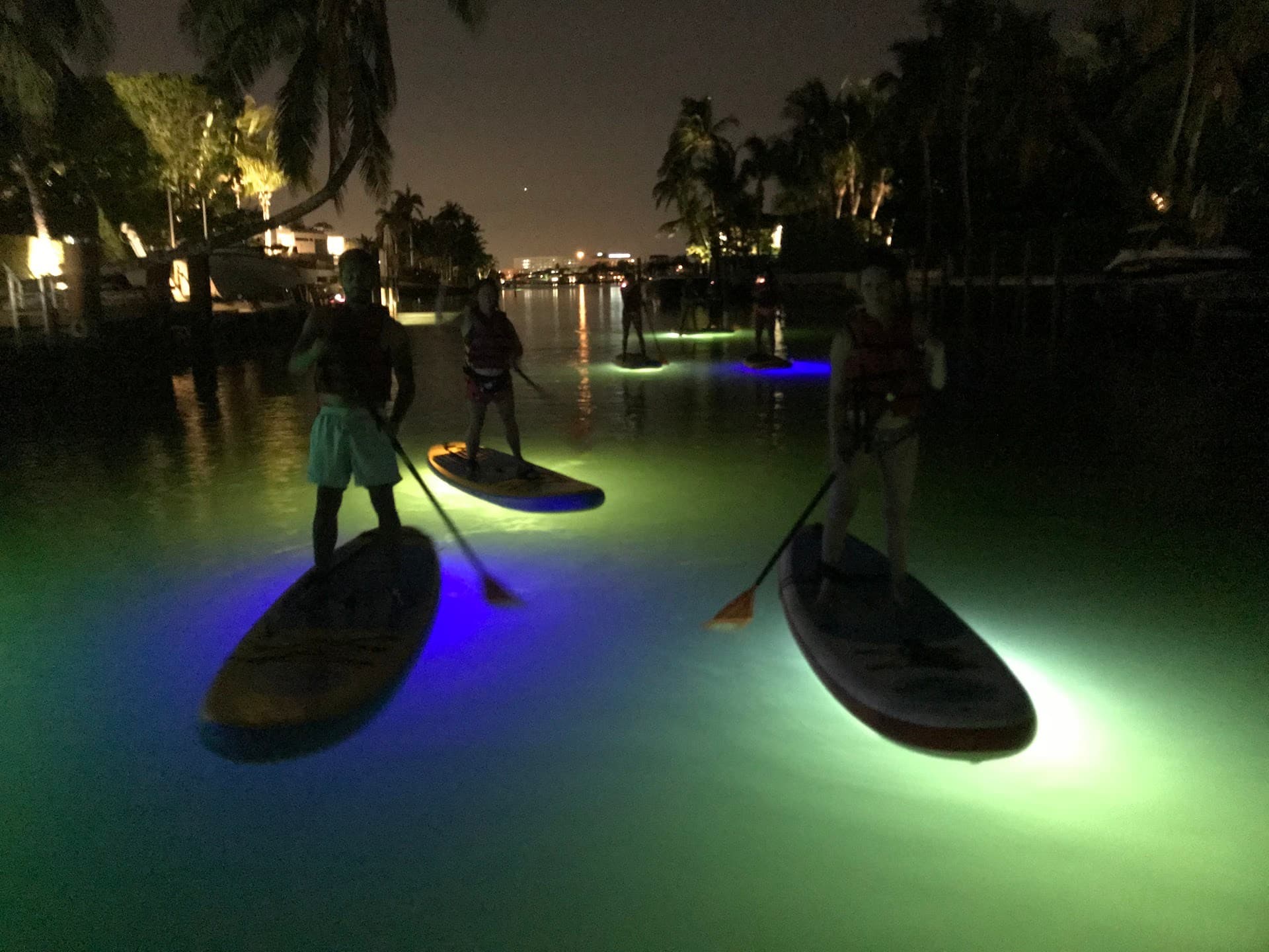 Paddleboarding at night in Miami Beach