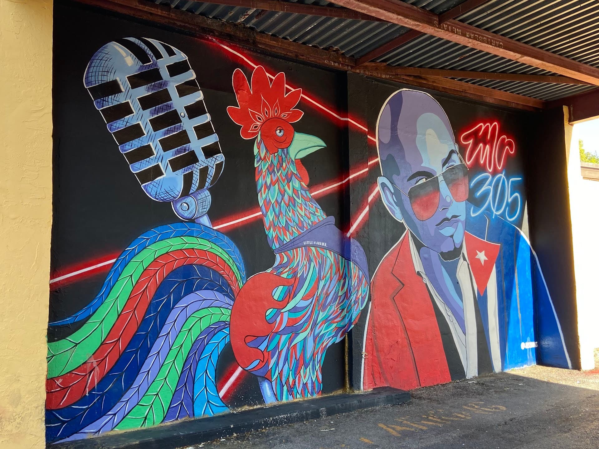 Colorful mural featuring a rooster and microphone in Miami Beach