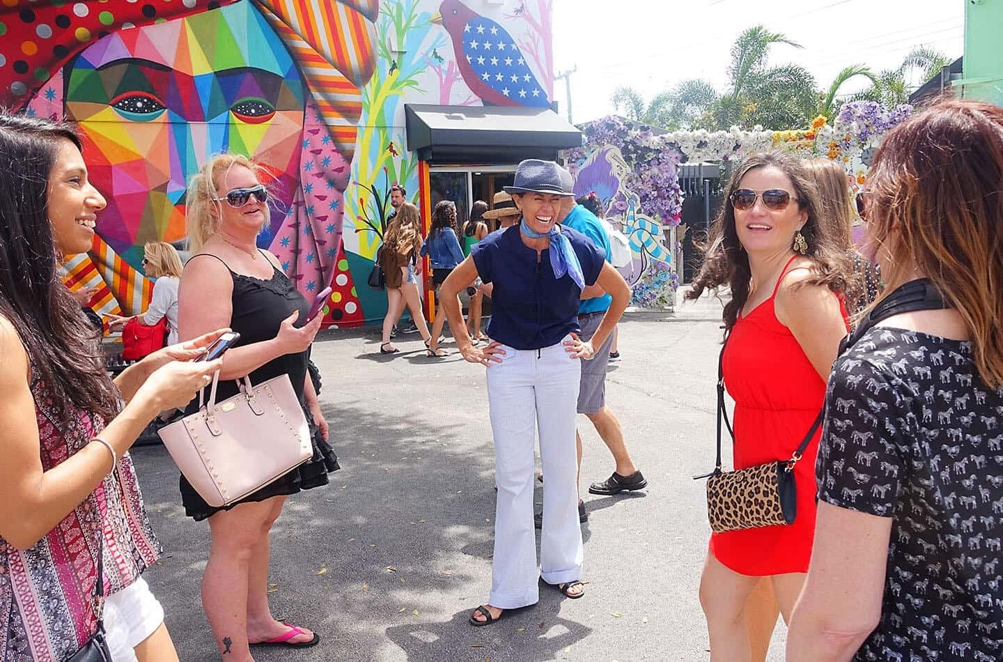 Colorful mural and group of people in Miami Beach