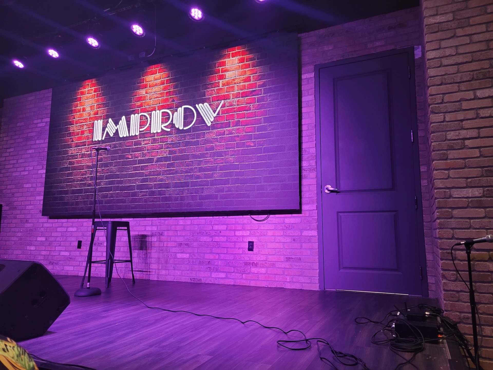 Miami Improv Comedy Club interior with stage and decor