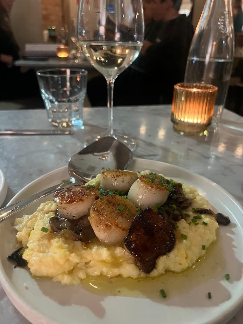 Seared scallops dish at Mignonette Downtown Miami