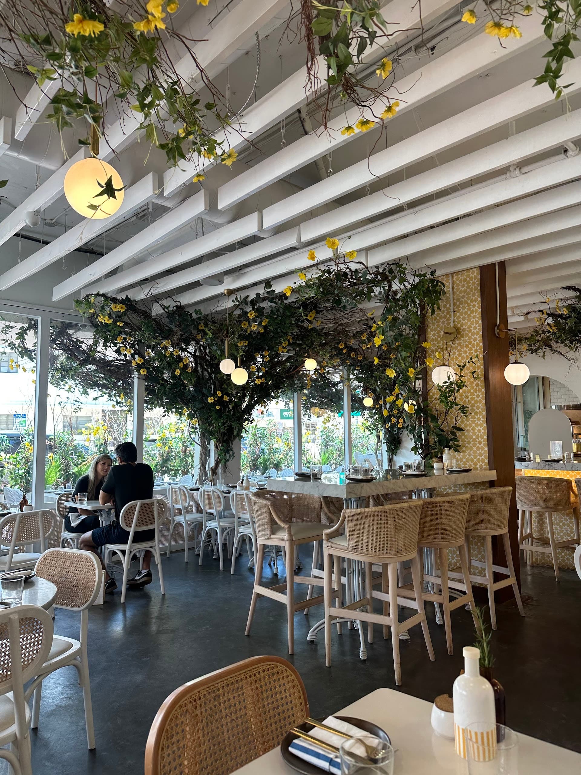 Interior dining scene at Motek Miami Beach