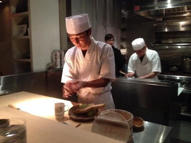 Sushi chef preparing dishes at NAOE in Miami
