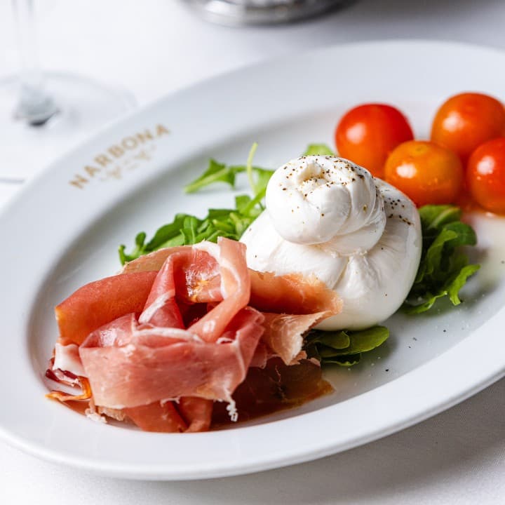 Burrata and prosciutto dish at Narbona Coconut Grove