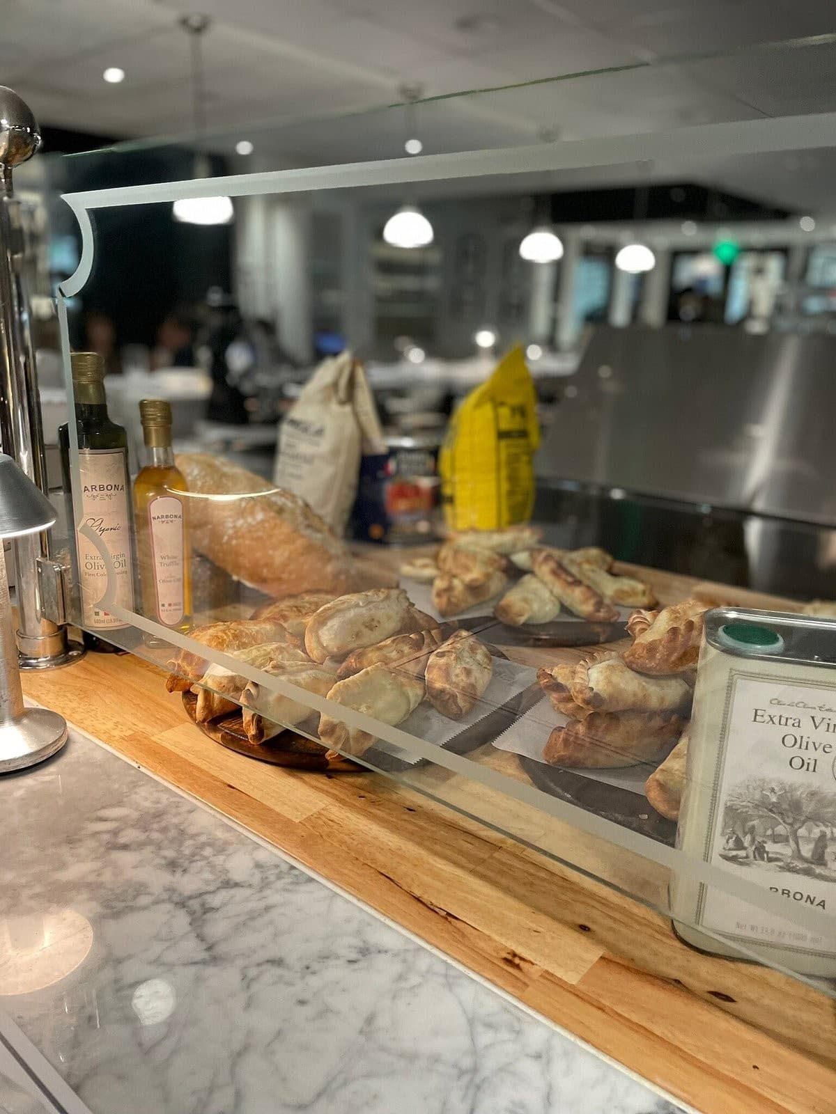 Narbona Coconut Grove interior with pastries and olive oil