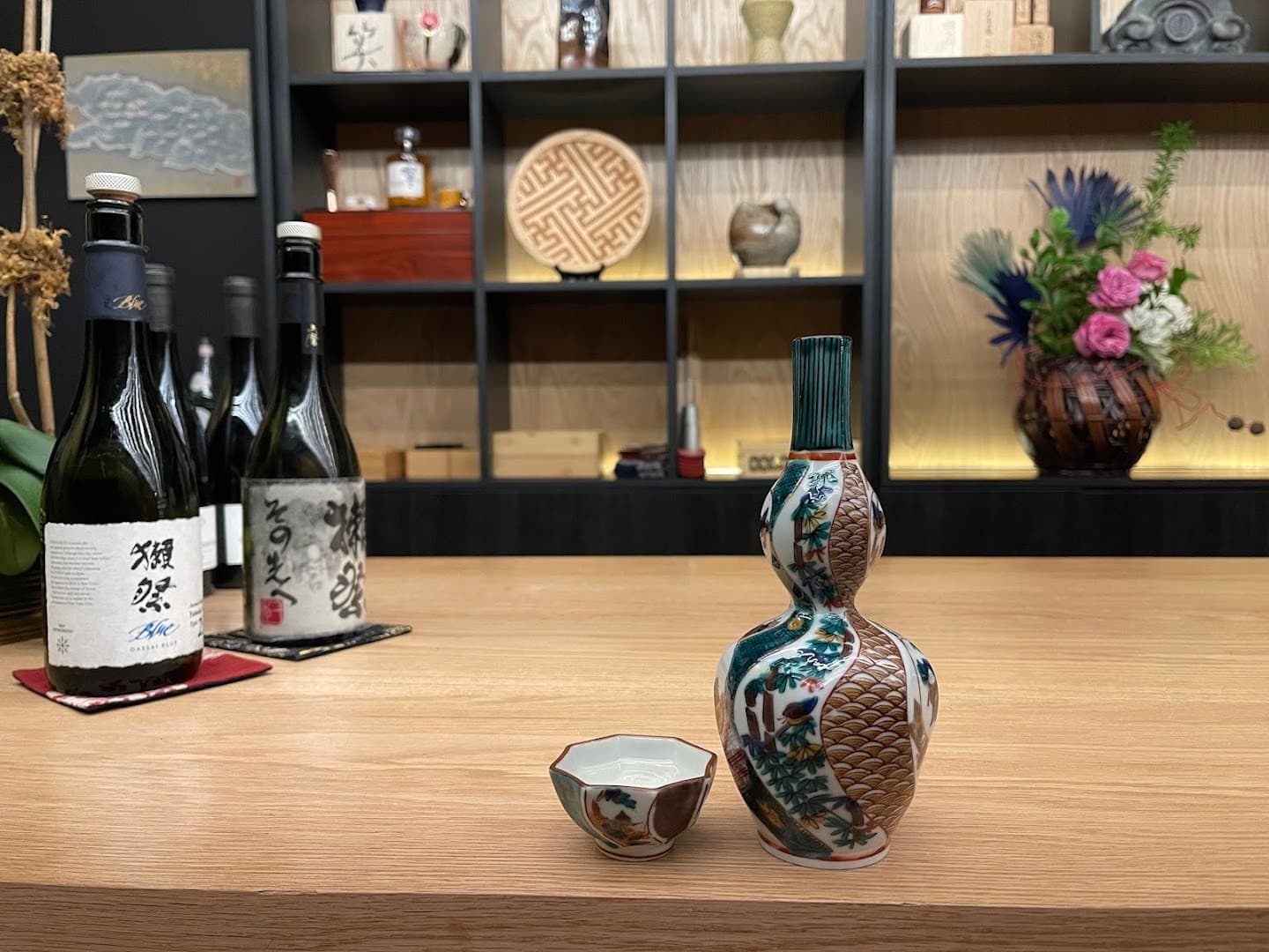 Decorative sake bottle and cups at Ogawa Miami