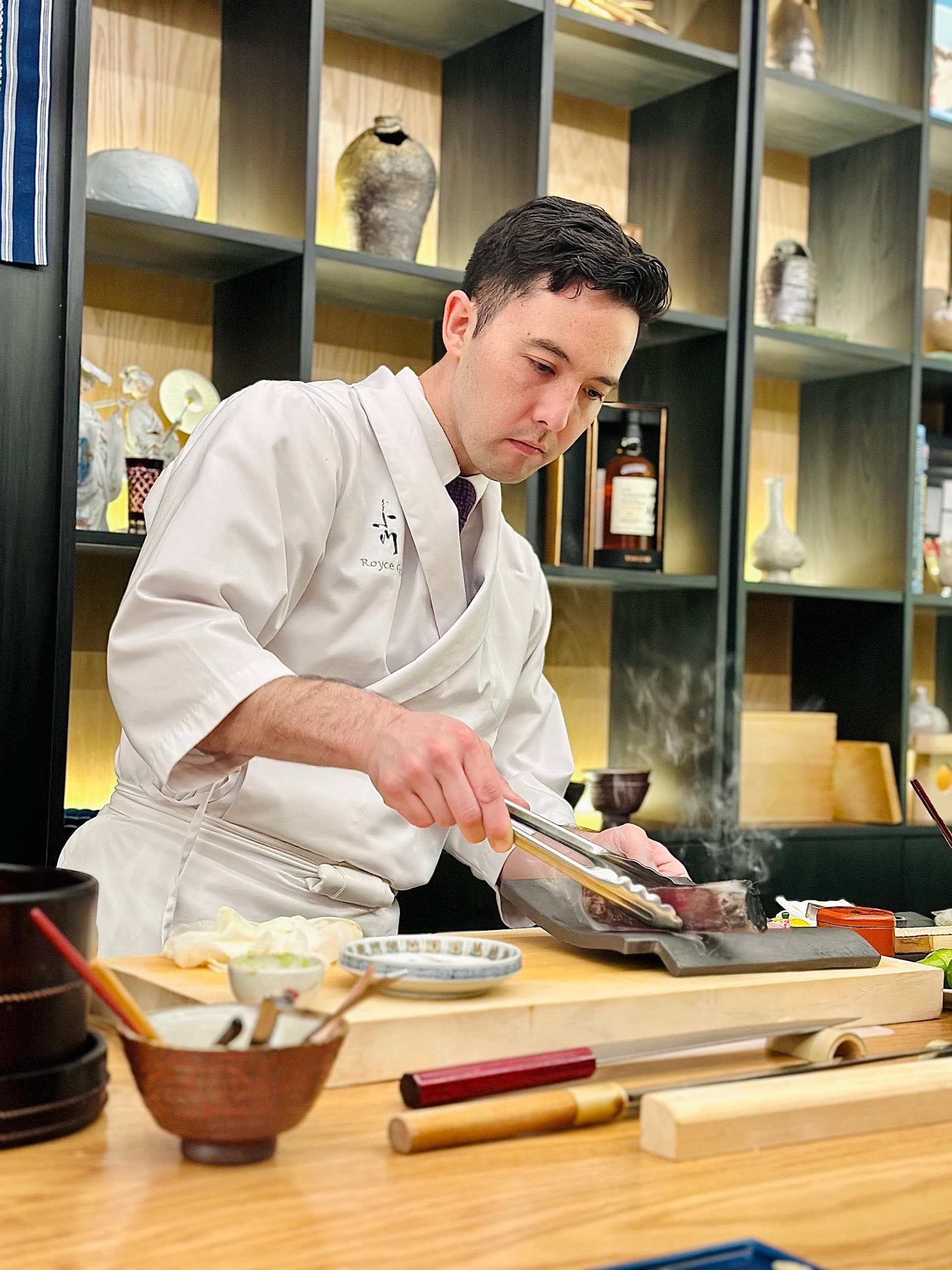 Chef preparing food at Ogawa Miami restaurant