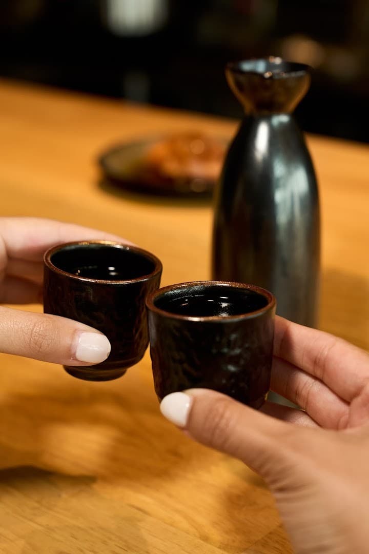 Sake cups at OMAKAI hand roll bar in Miami