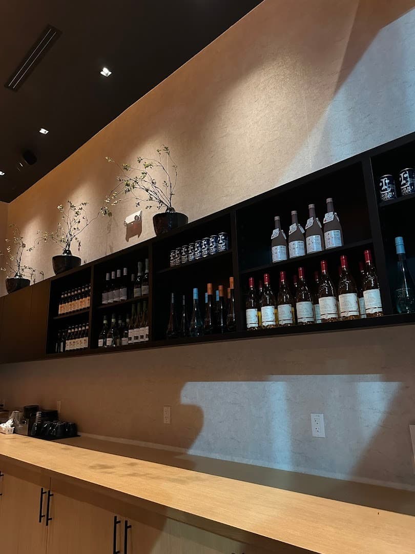 Omakai hand roll bar interior with wine selection in Miami