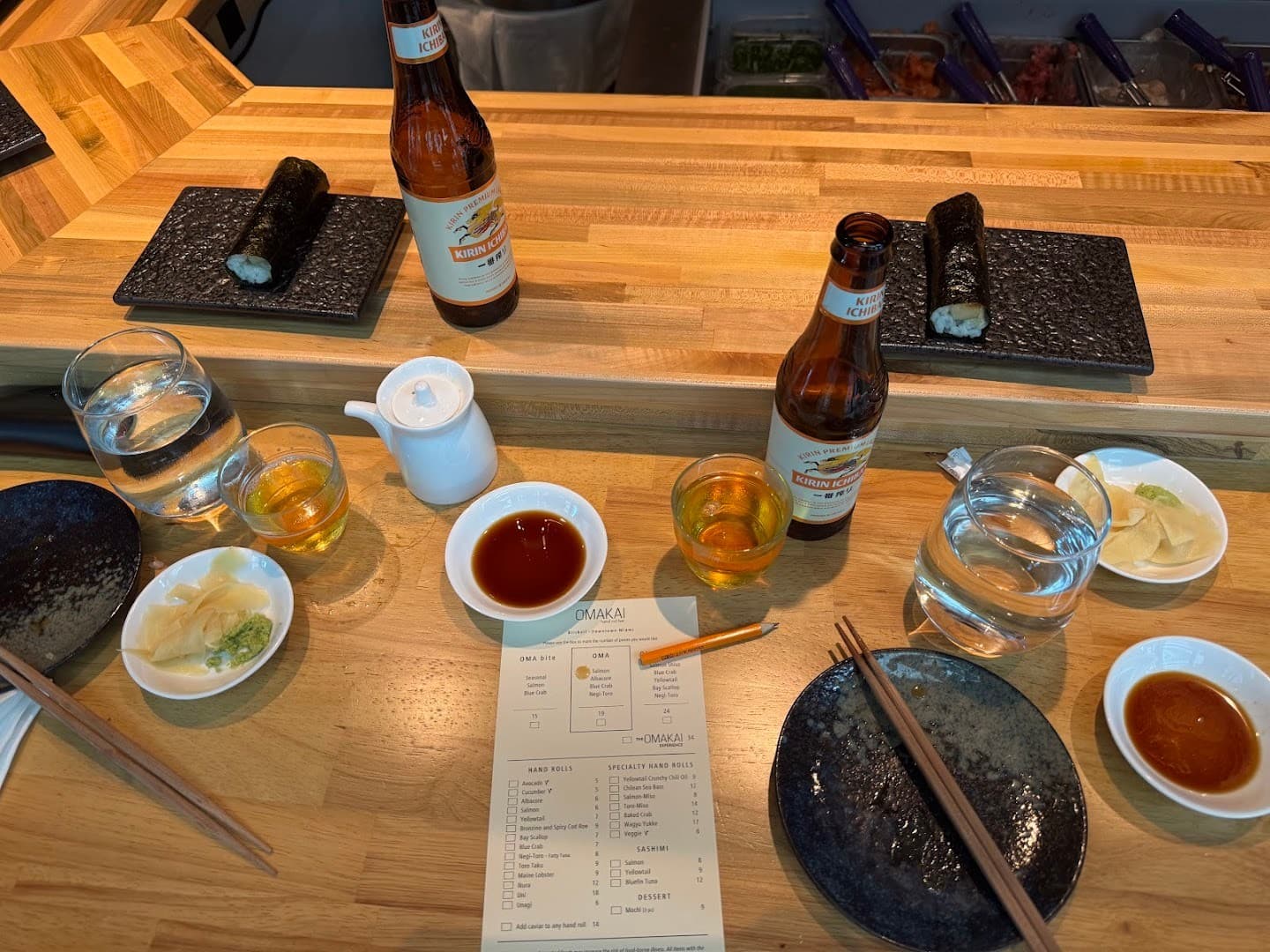 Dining scene at OMAKAI hand roll bar in Miami