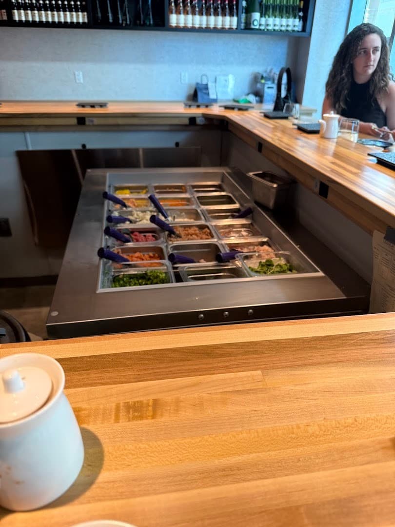 Omakai hand roll bar interior with toppings Miami