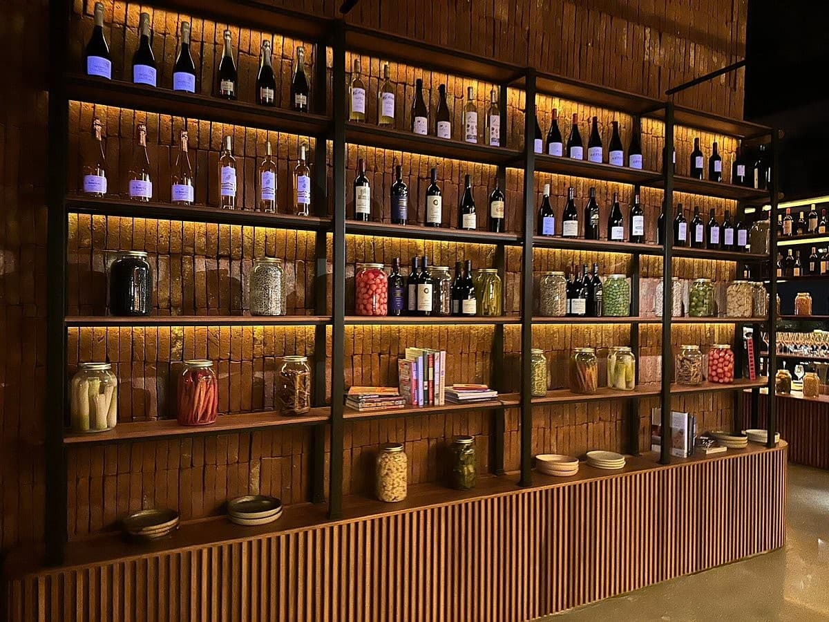 Interior of Ossobuco Miami steak house with shelves