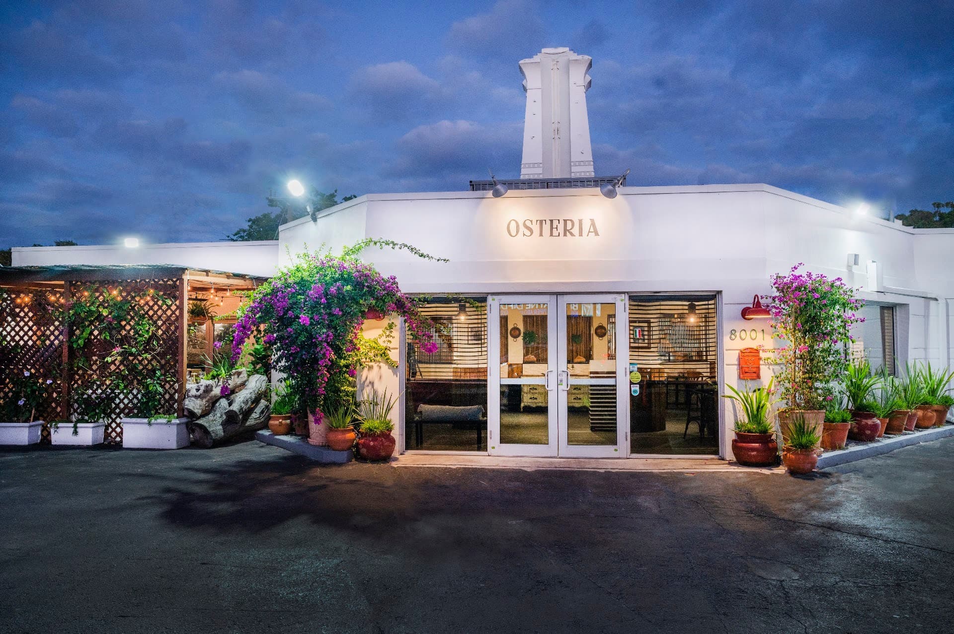 Osteria restaurant exterior in Miami at dusk