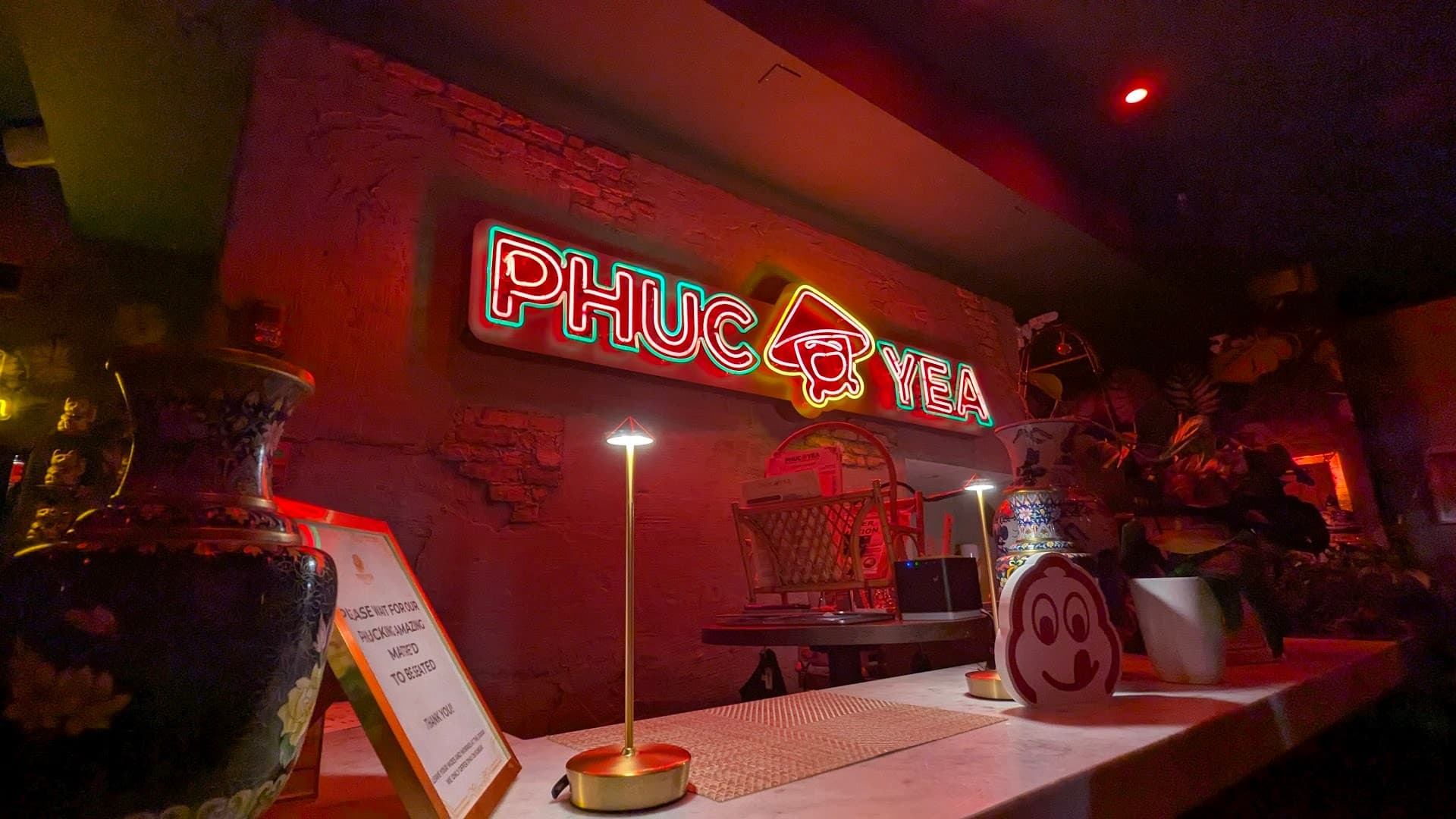 Phuc Yea restaurant interior with neon sign in Miami
