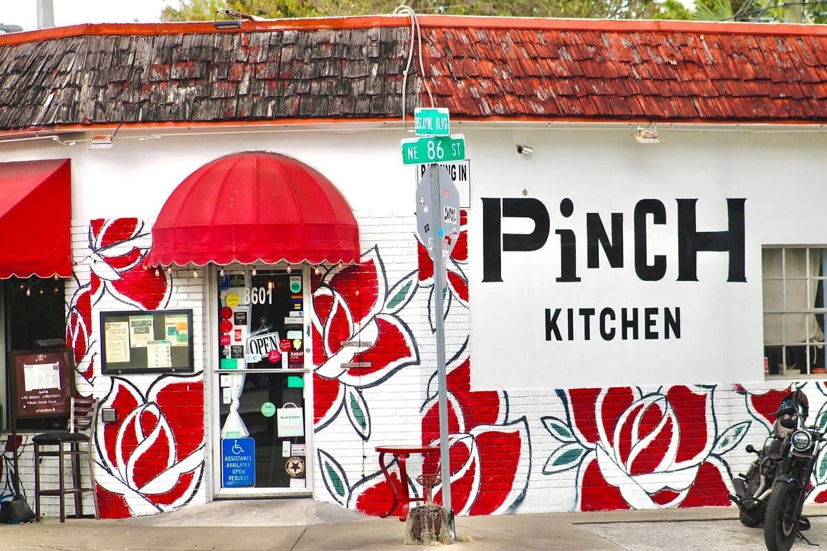 Pinch Kitchen exterior in Miami with red roses