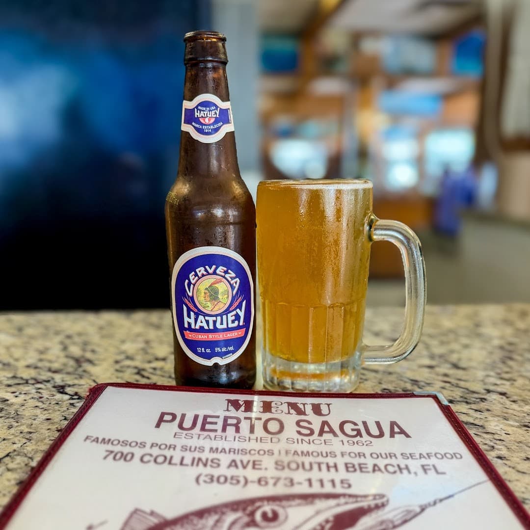 Hatuey beer and menu at Puerto Sagua Restaurant in Miami Beach