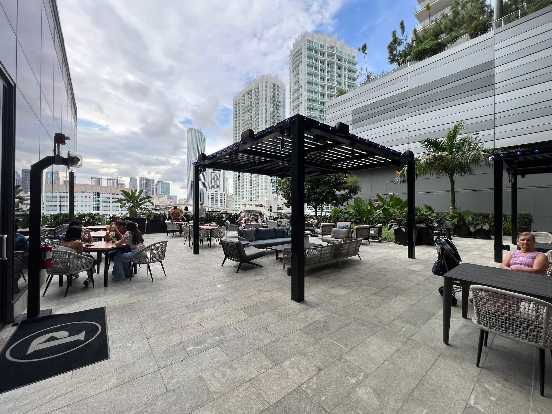 Outdoor seating area at Puttshack - Miami, 701 S Miami Ave Level 4