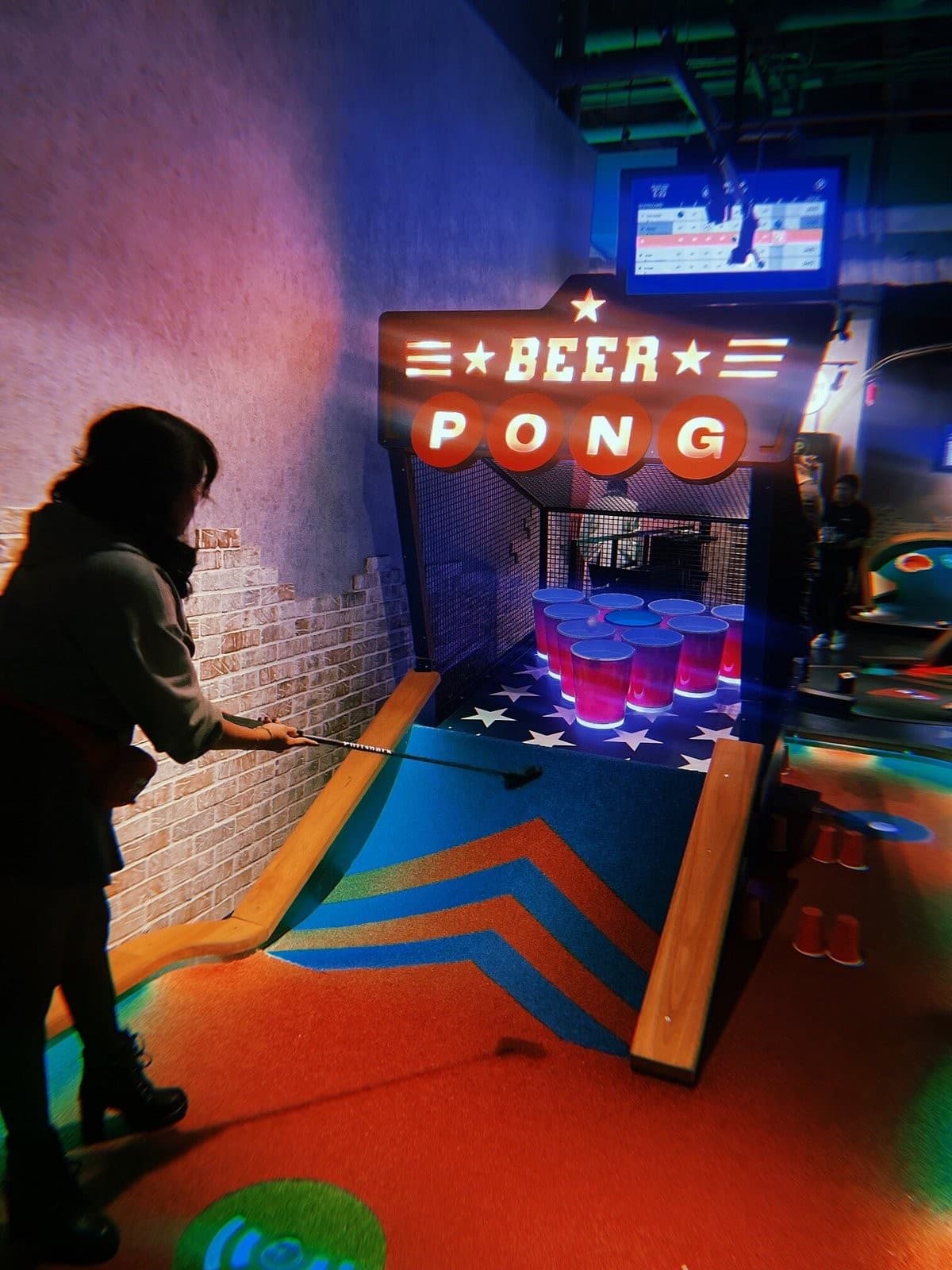 Beer Pong game at Puttshack Miami, 701 S Miami Ave Level 4