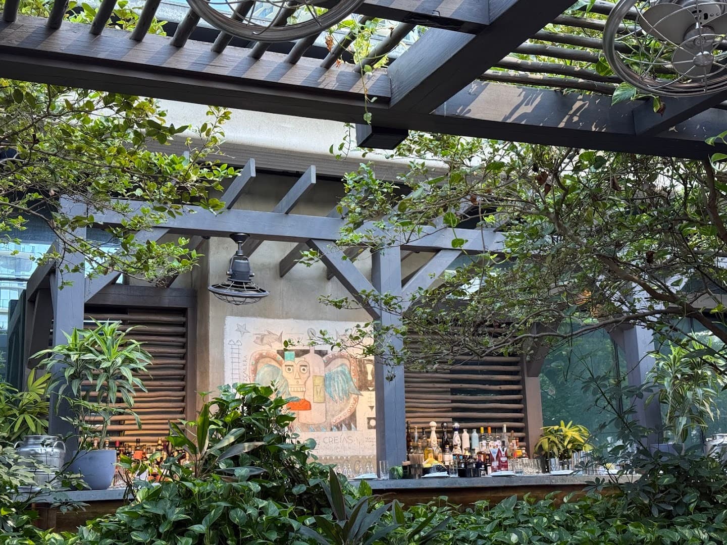 Quinto Miami bar area with greenery