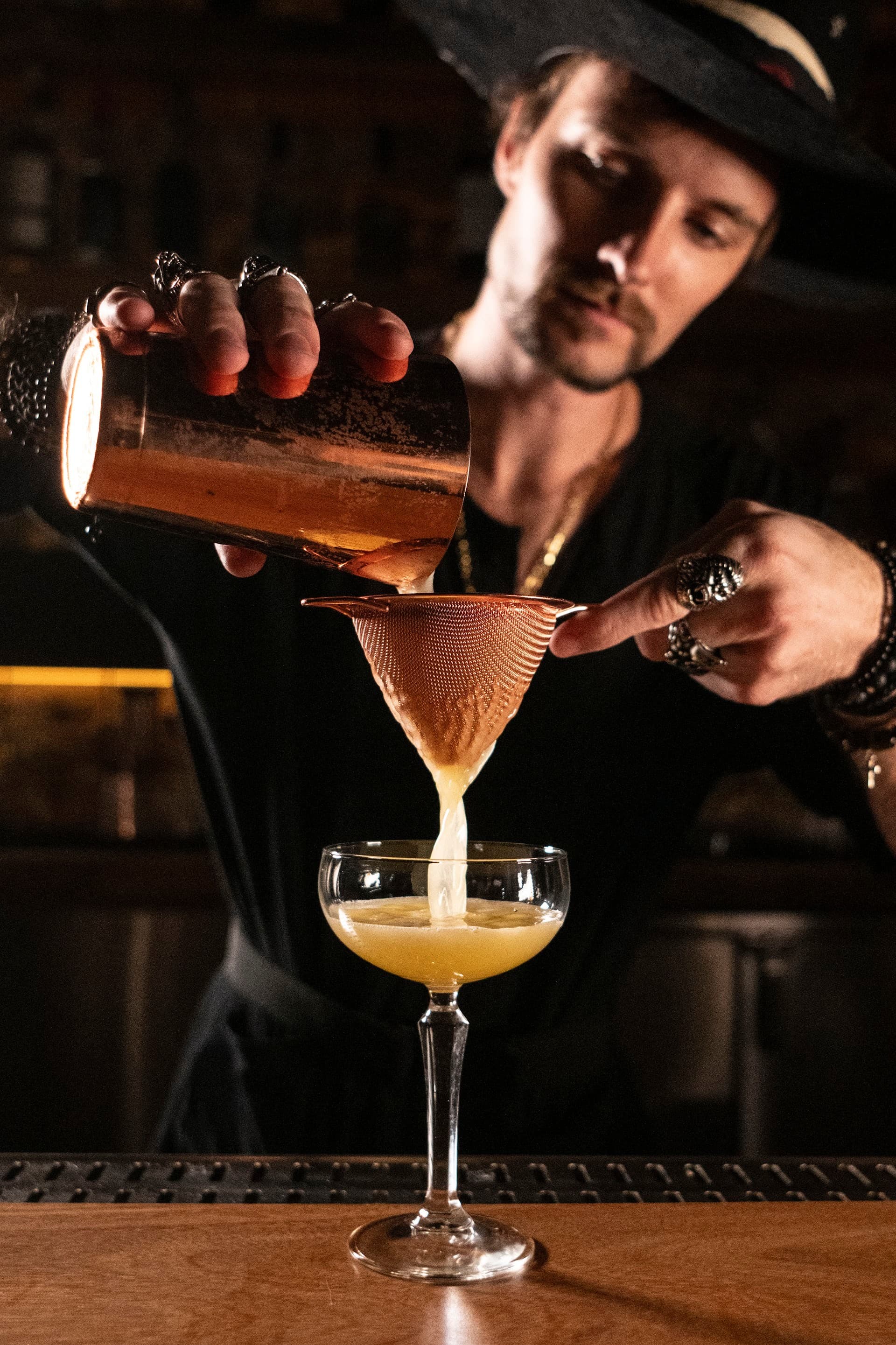 Bartender pouring cocktail at RosaNegra Miami