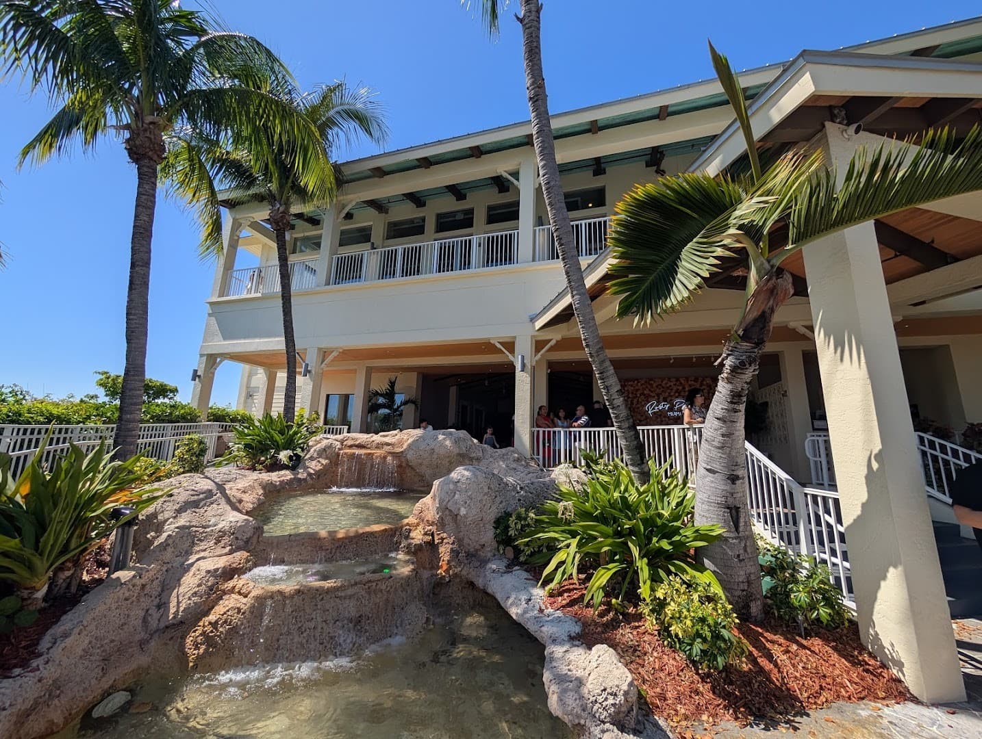Rusty Pelican Miami restaurant exterior with palm trees