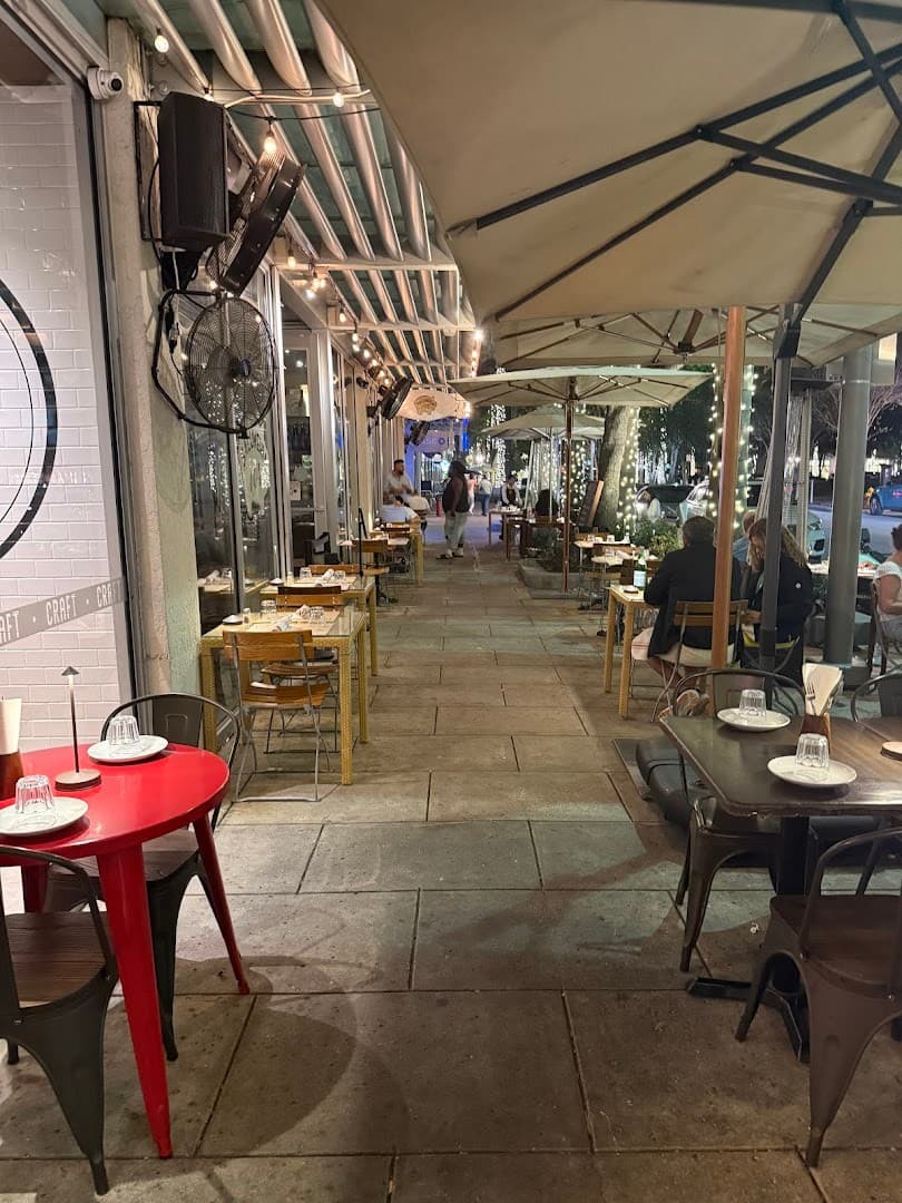 Outdoor dining area at Salumeria 104 in Miami