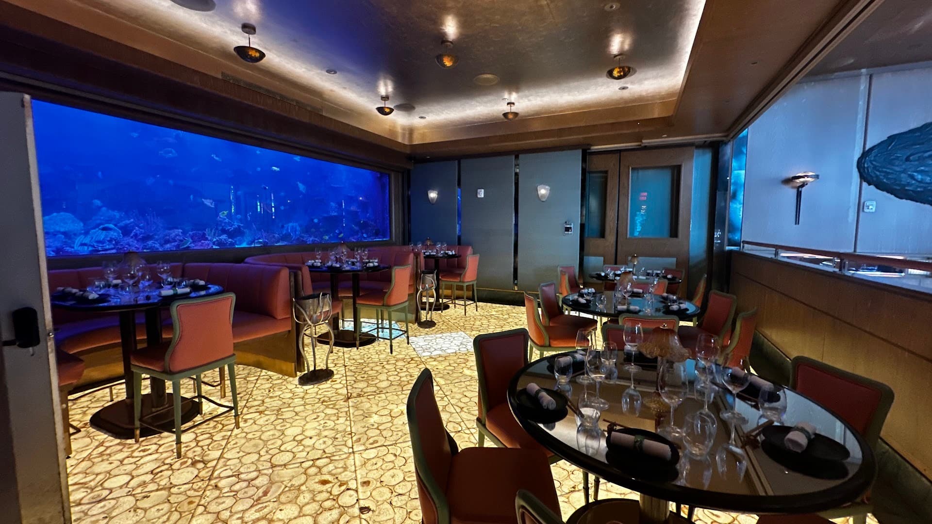 Interior of Sexy Fish Miami restaurant with aquatic backdrop