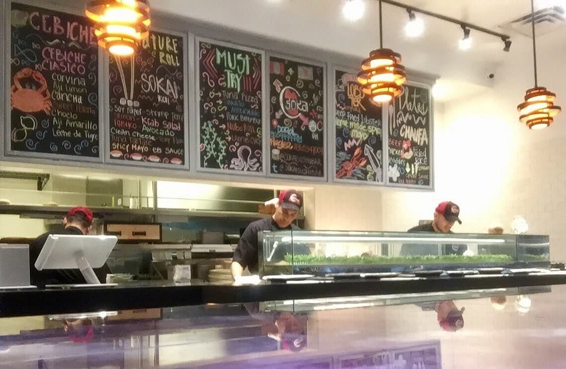 Sokai Sushi Bar Doral interior with menu and staff