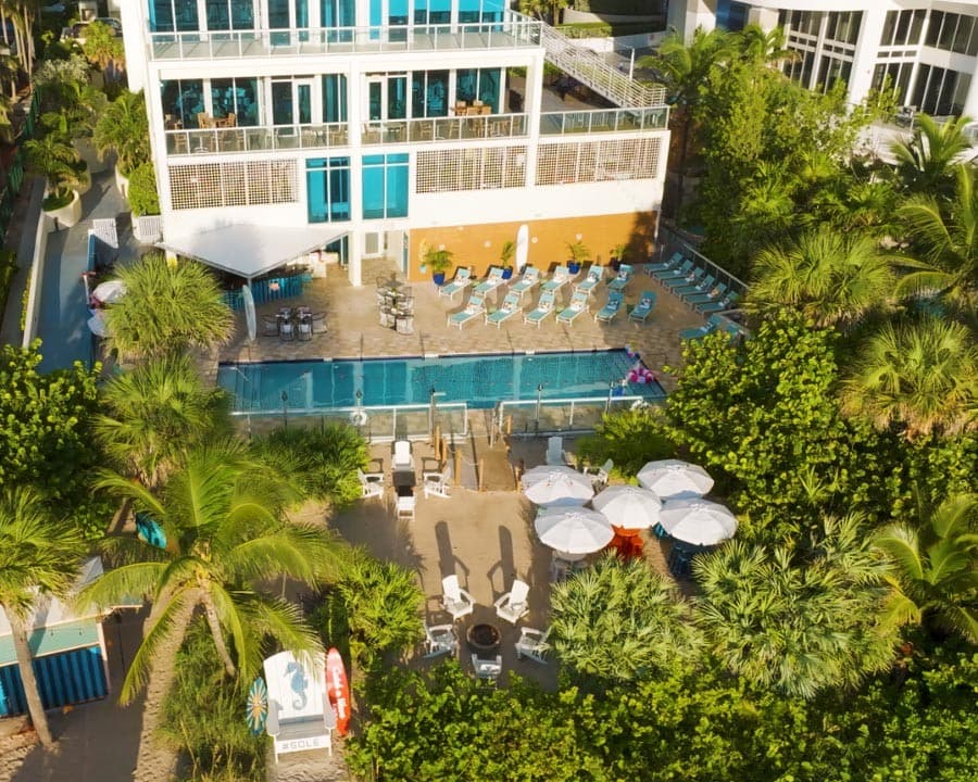 Solé Miami pool area with lounge chairs at Sunny Isles Beach