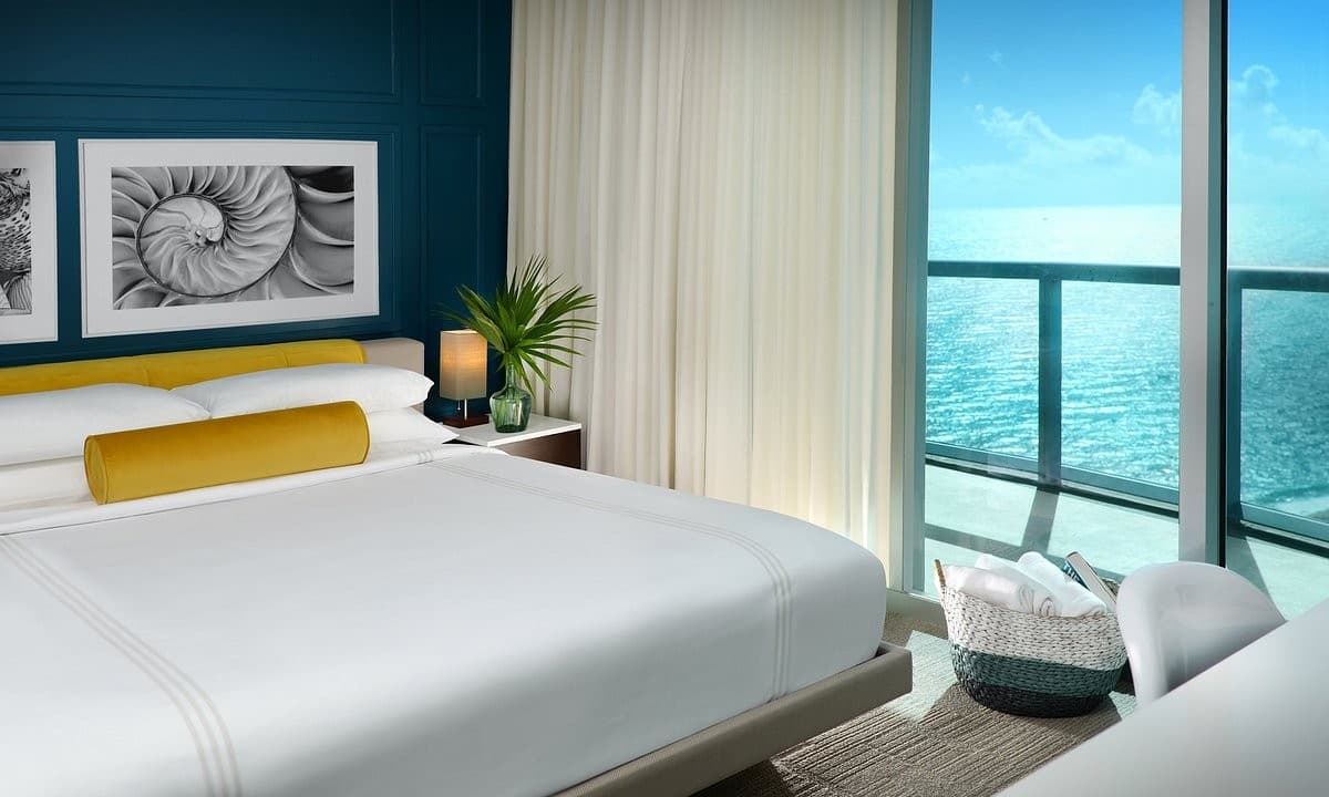 Luxurious bedroom at Solé Miami, A Noble House Resort in Sunny Isles Beach