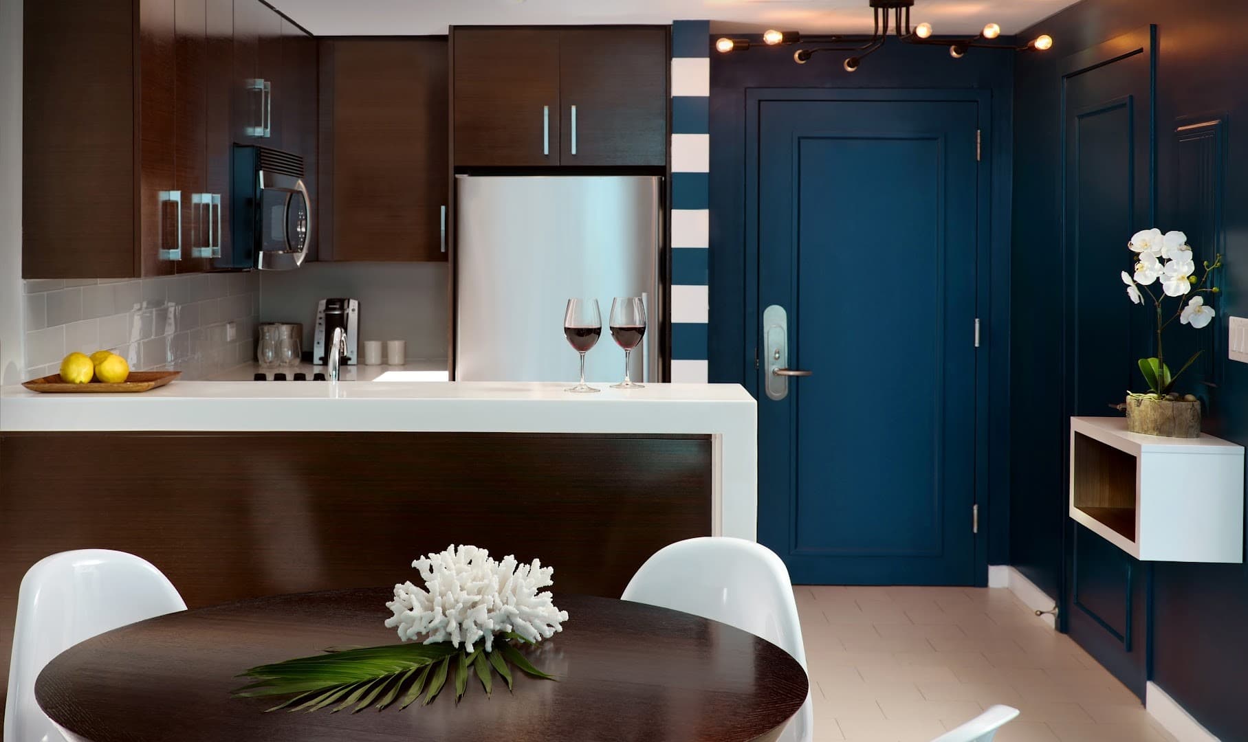 Modern kitchen and dining area at Solé Miami, A Noble House Resort in Sunny Isles Beach