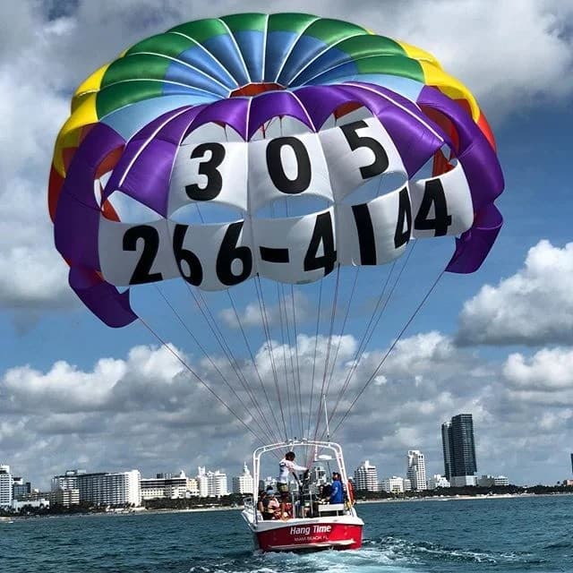 Parasailing at South Beach, Miami with colorful parachute