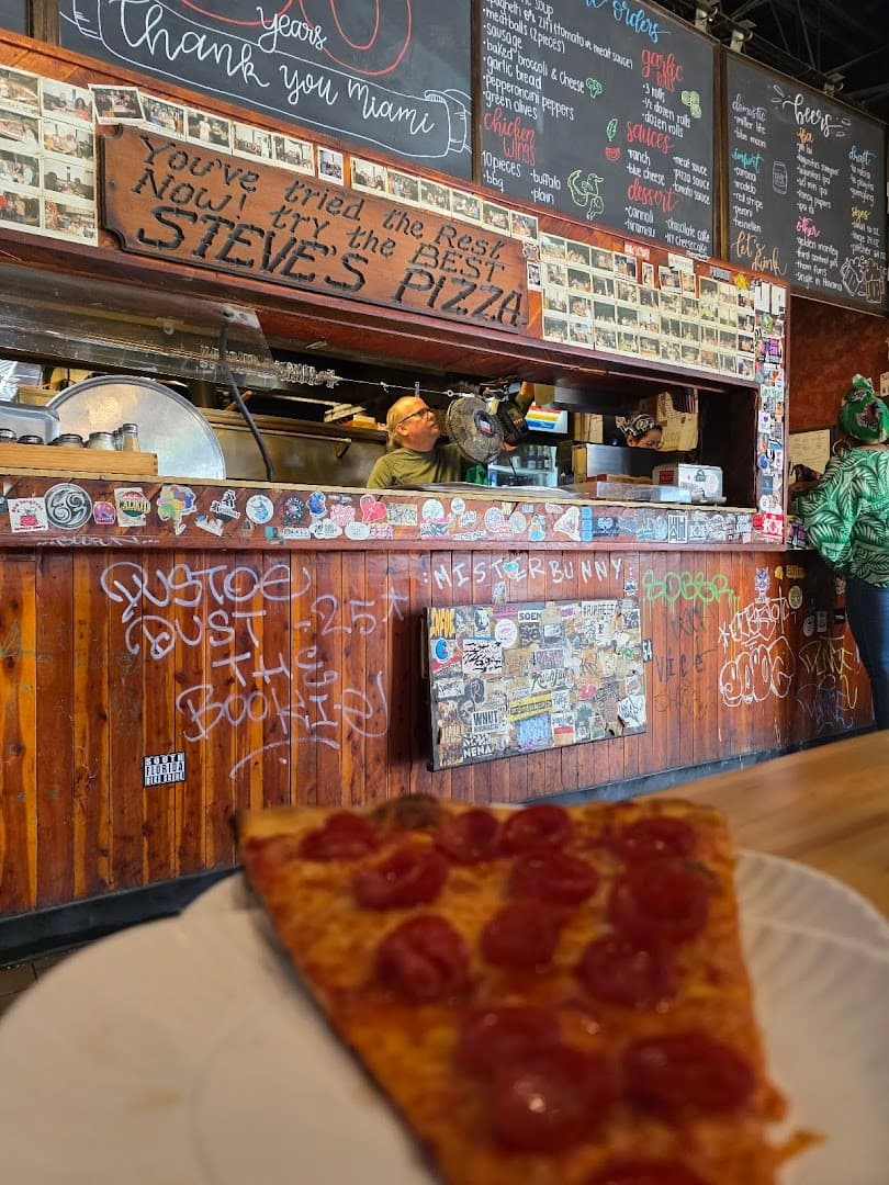 Steve's Pizza interior with pizza slice in Miami