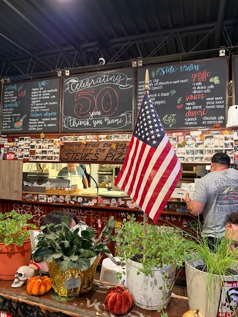 Steve's Pizza interior with American flag in Miami