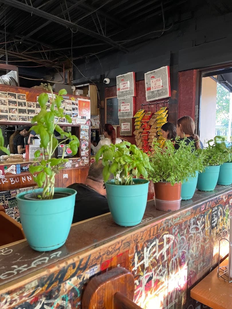 Interior view of Steve's Pizza in Miami with plants