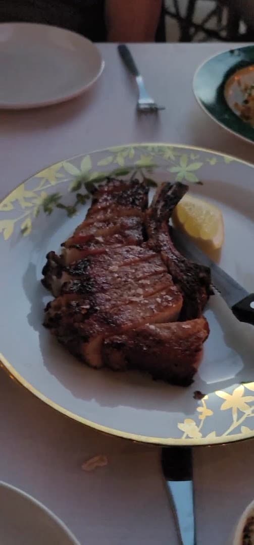 Grilled pork chop dish at Sunny’s Steakhouse in Miami