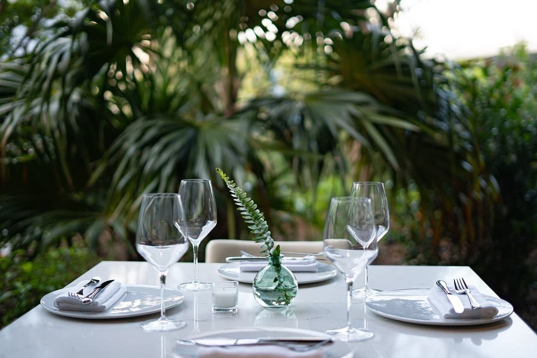 Dining room at Superblue Miami with greenery