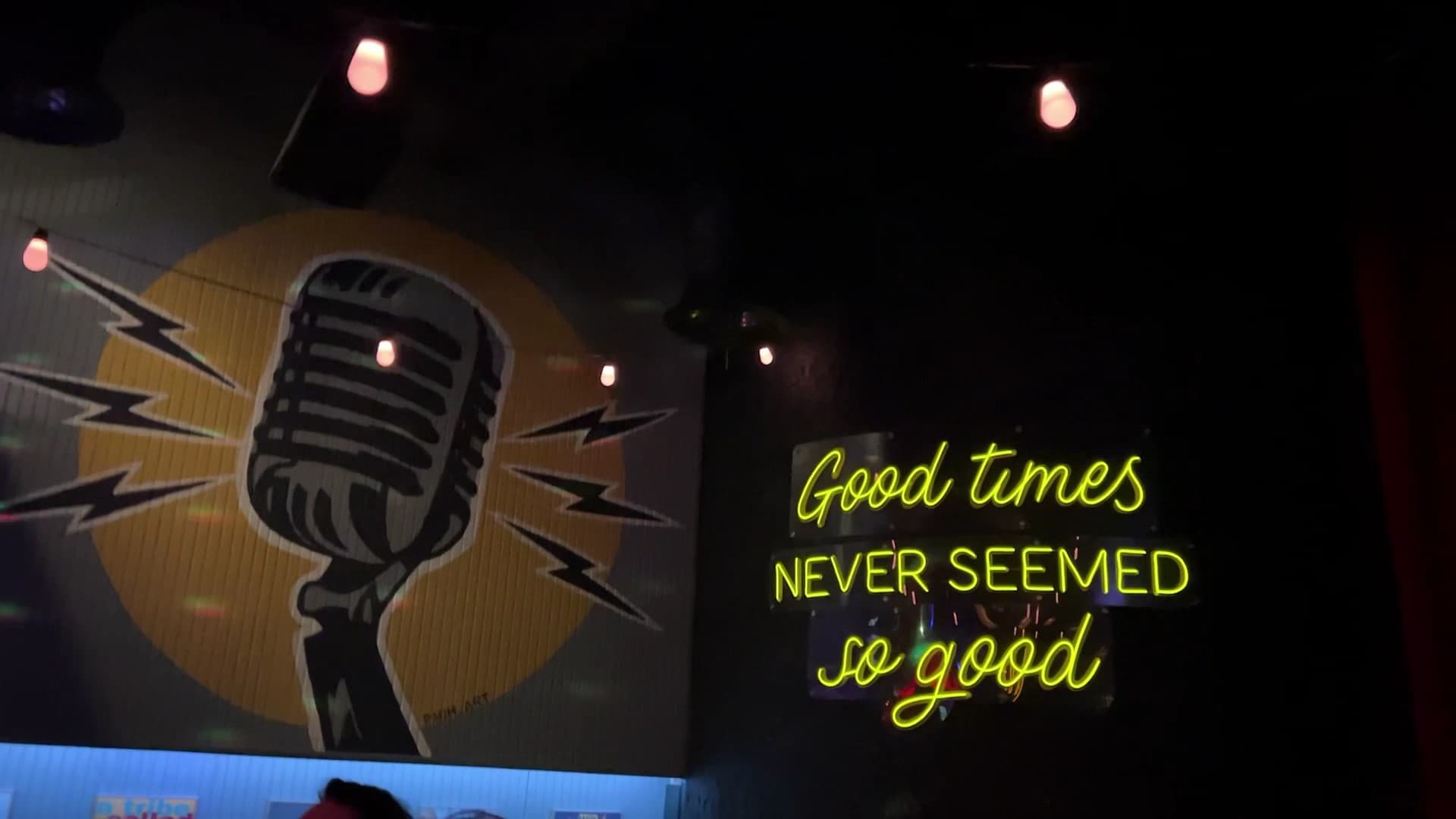 Sweet Caroline Karaoke Bar interior with neon sign in Miami