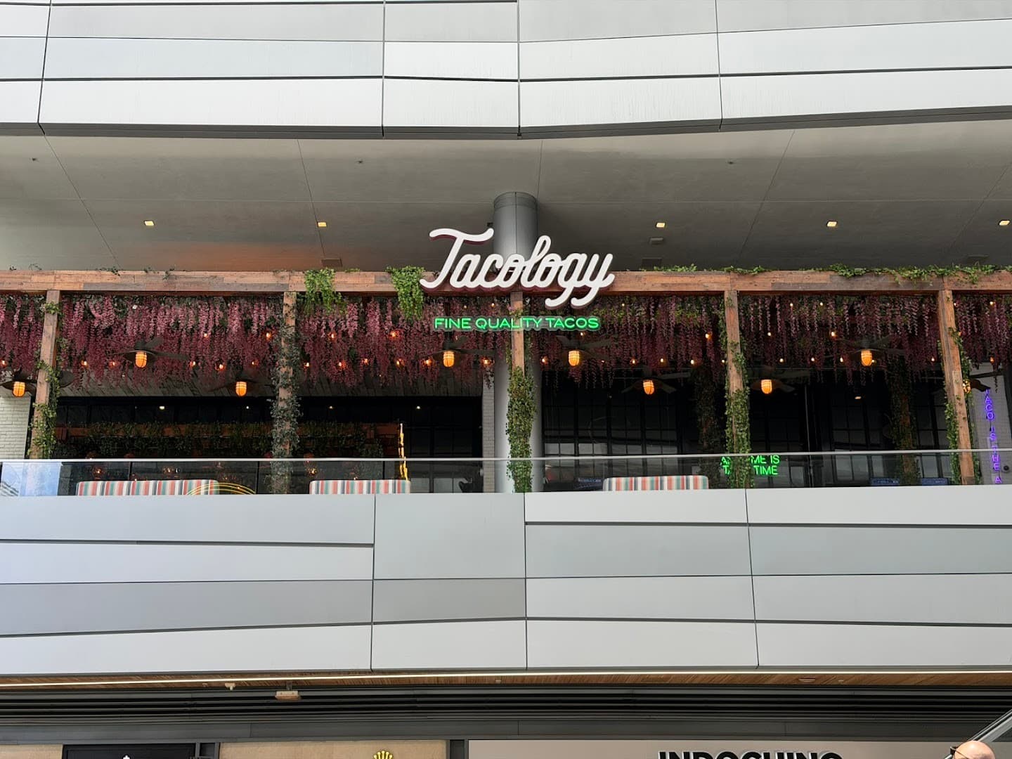 Tacology Brickell restaurant signage with greenery