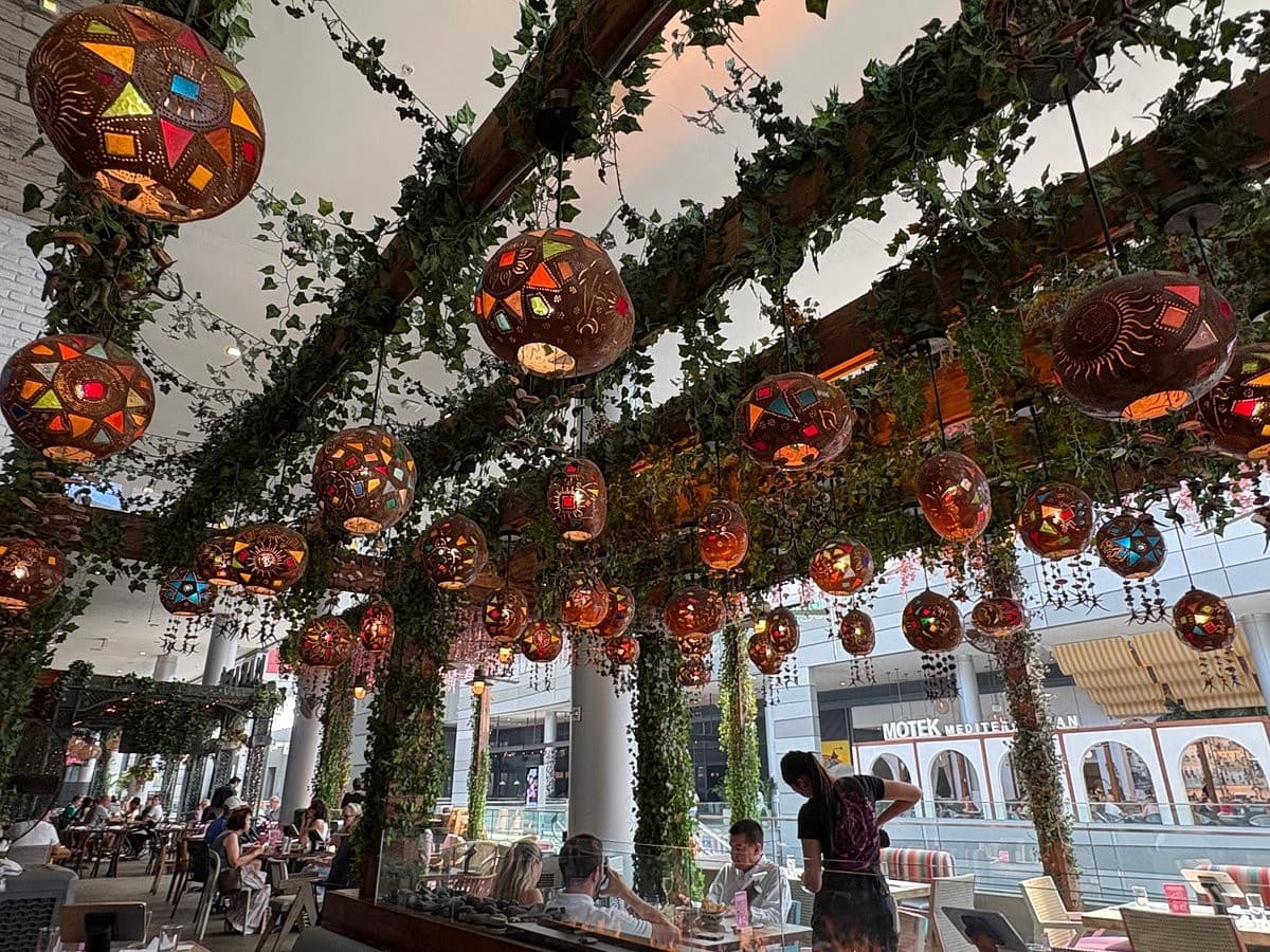 Tacology Brickell vibrant interior with colorful hanging decor