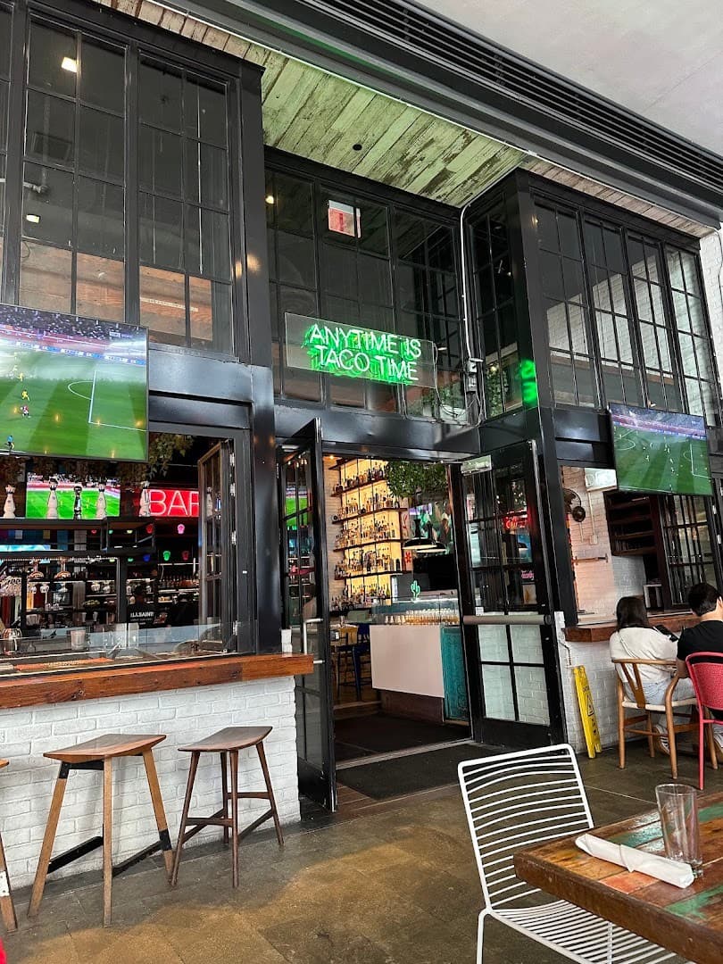 Tacology Brickell vibrant interior with bar and screens