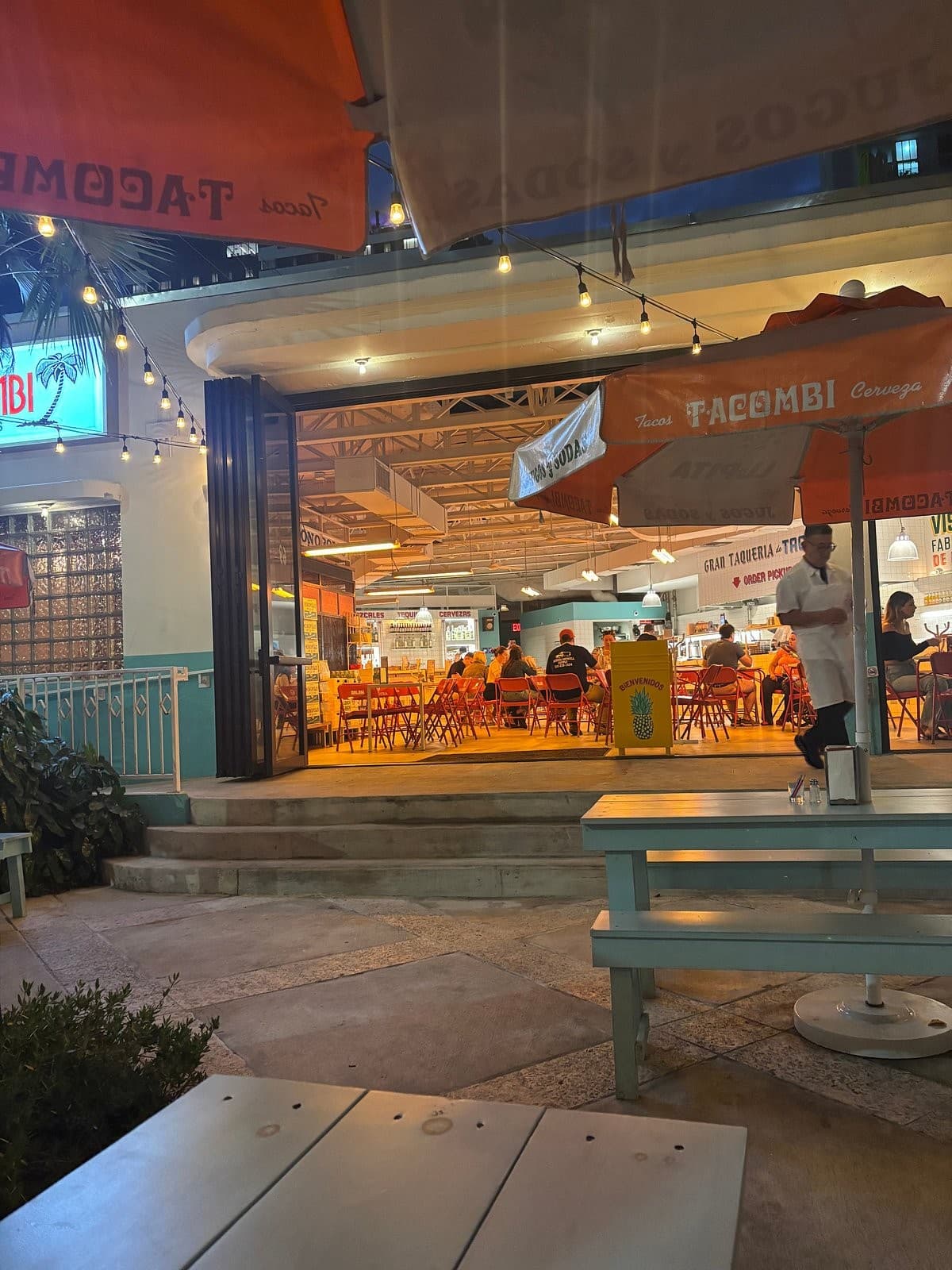 Dining scene at Tacombi in Miami with vibrant atmosphere