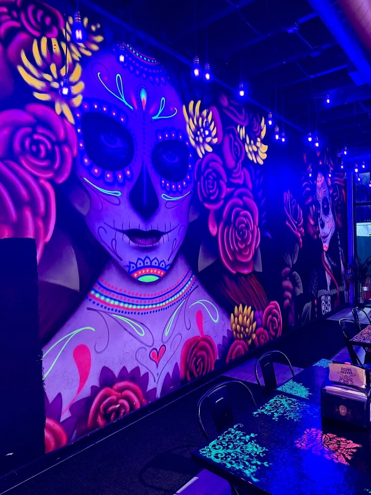 Vibrant interior mural at Talkin' Tacos Wynwood in Miami