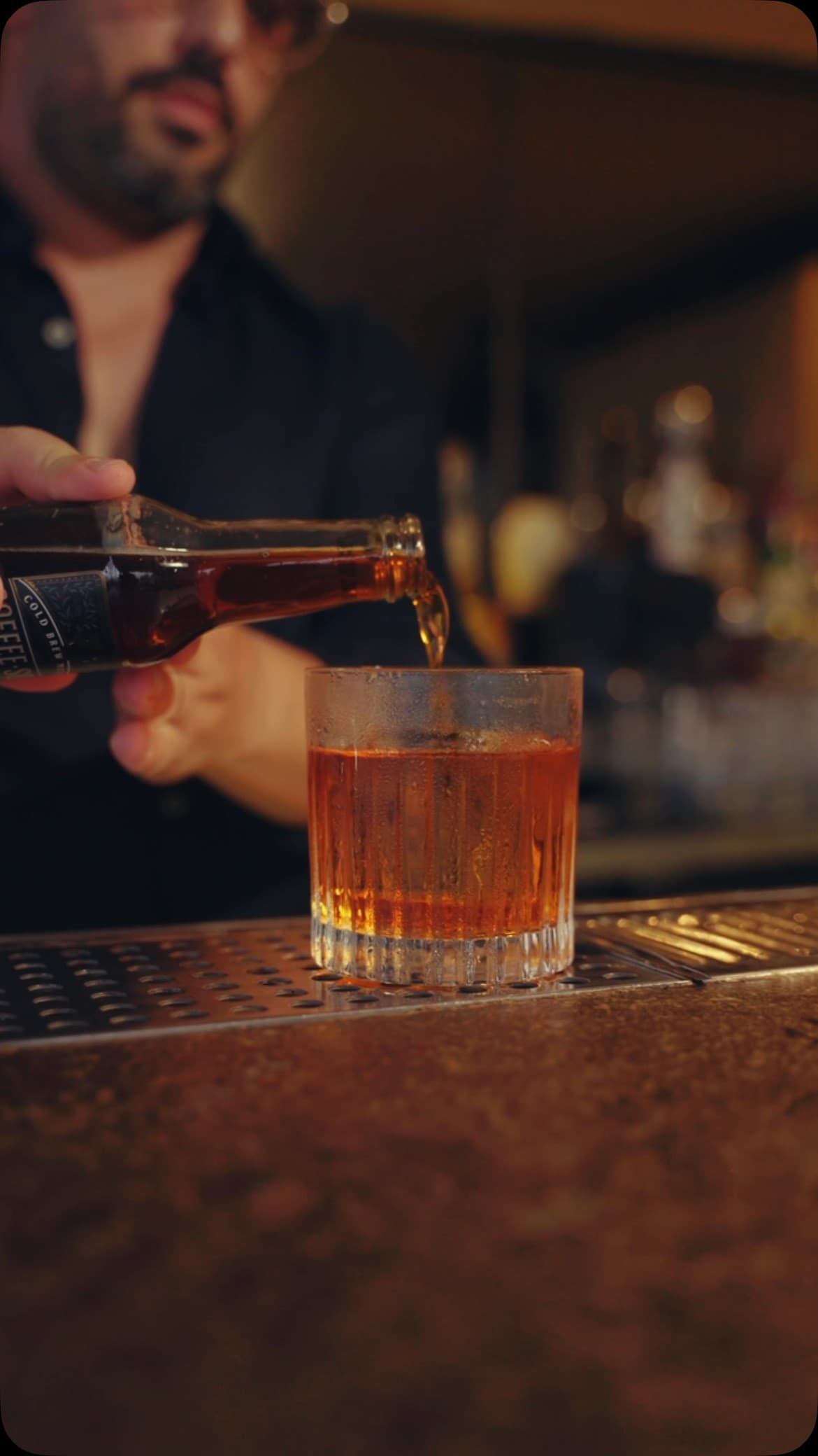Bartender pouring drink at Terras Miami Rooftop