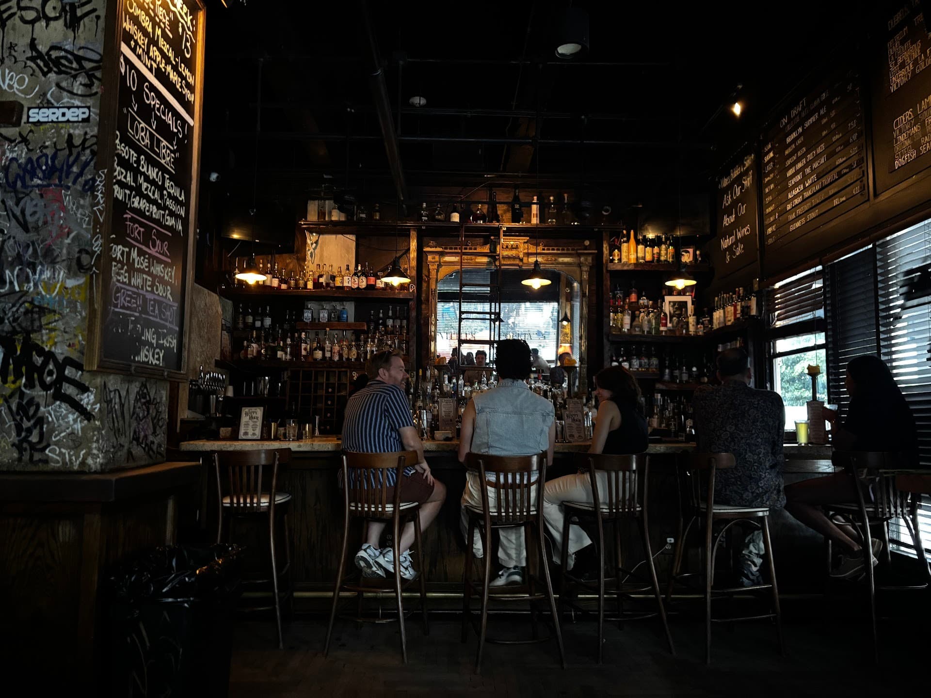 Bar scene at The Corner in Miami with patrons