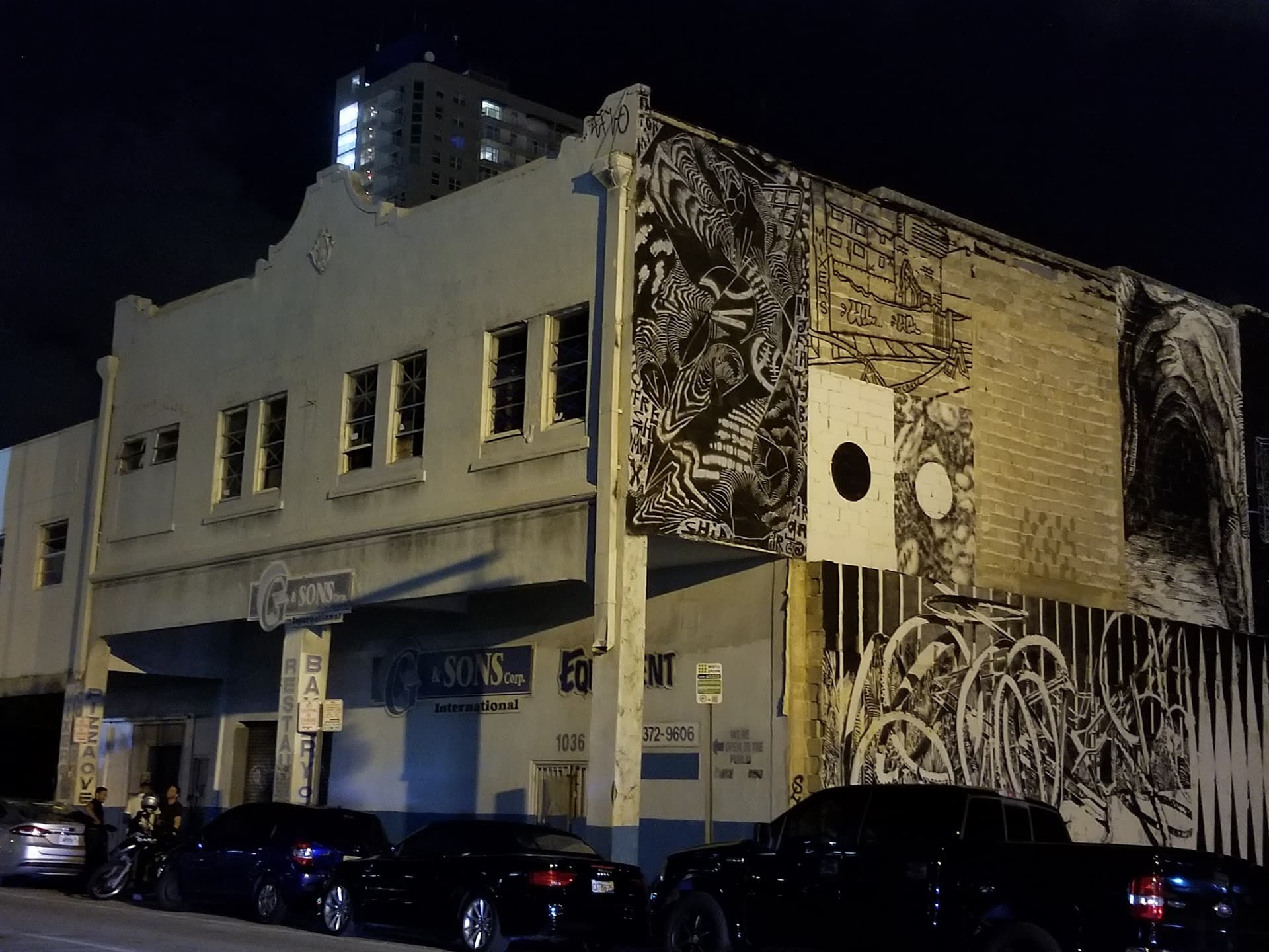 Exterior view of The Corner restaurant at night in Miami